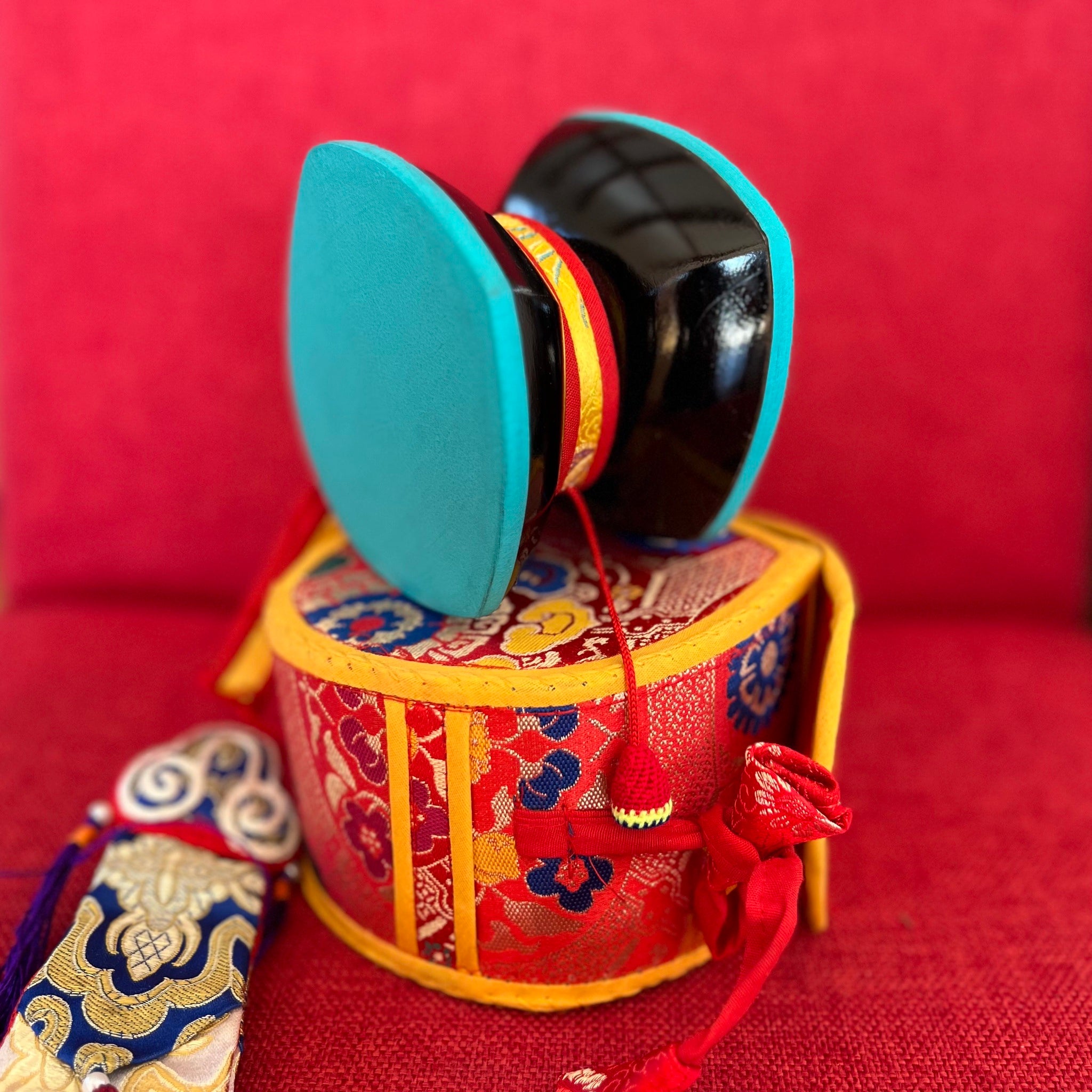 12.5cm Damaru or ritual hand drum with turquoise coloured skin and a red cover