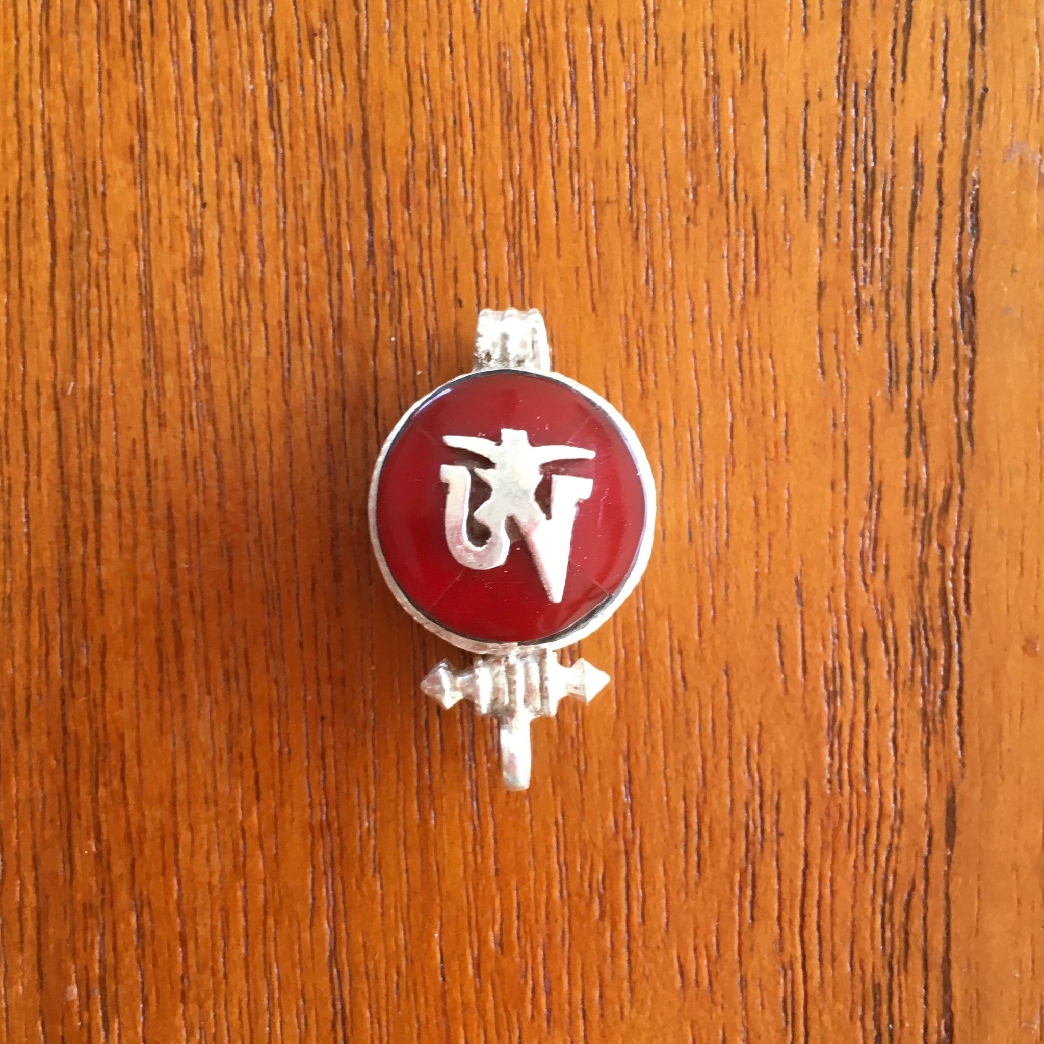 1.5cm diameter Sterling Silver Locket with the Tibetan Om symbol set on red colour semi-precious stone