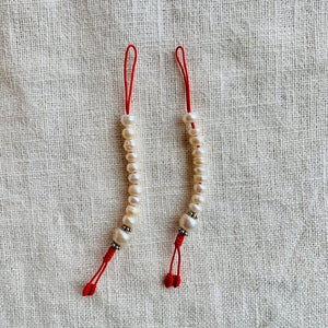 Pearl Mala Counters with red string and 7mm wide beads
