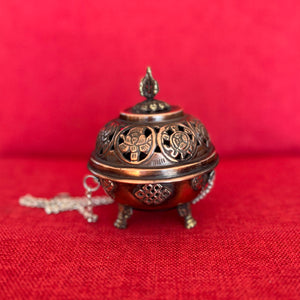 9.5cm Diameter Hanging Copper Incense Burner with oxidised finish and 8 Auspicious Symbols around the lid