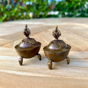 Pair of 6.5cm High Oxidised Brass Kapala with Skull Legs