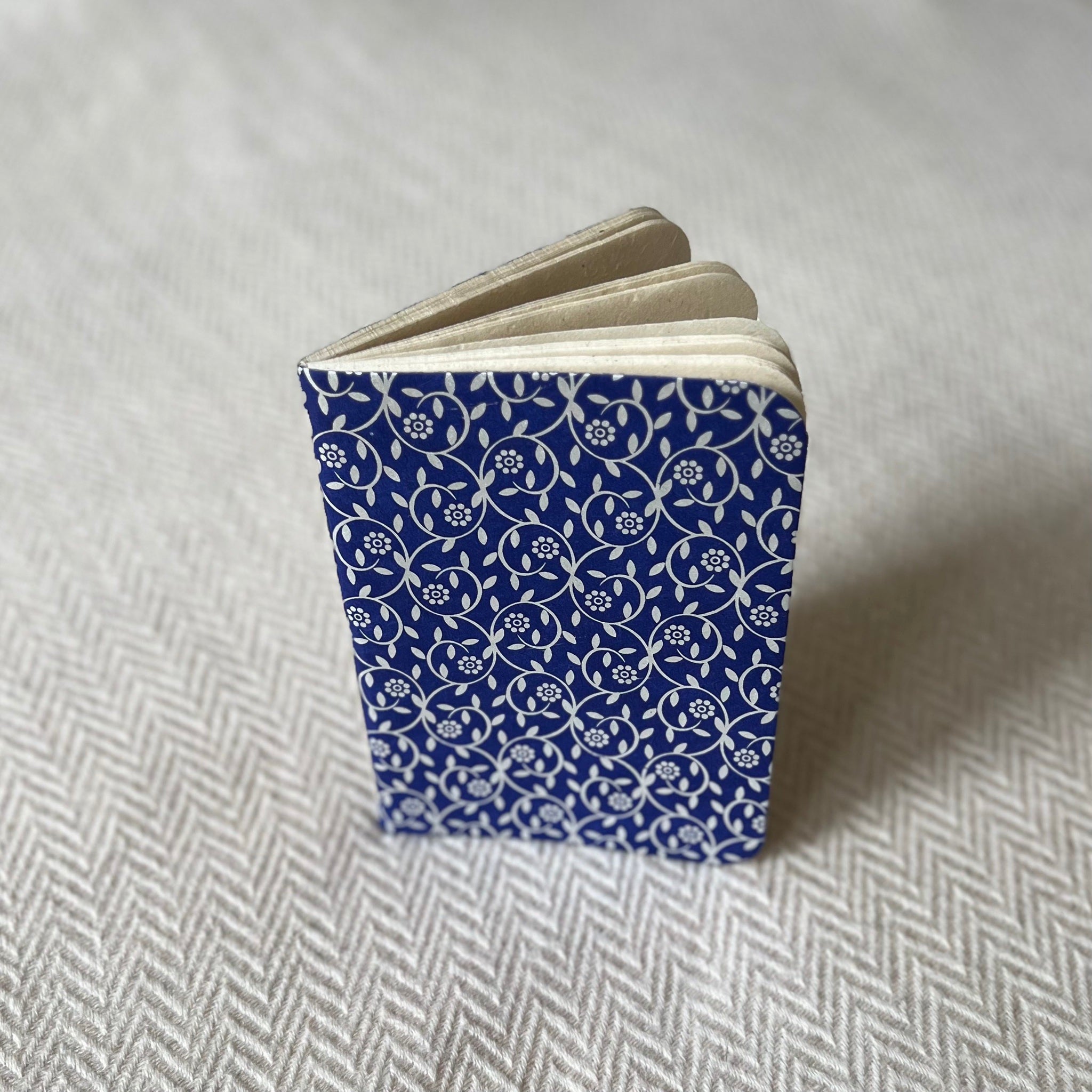Lokta Paper Notebook in a dark blue colour with a silver flower pattern