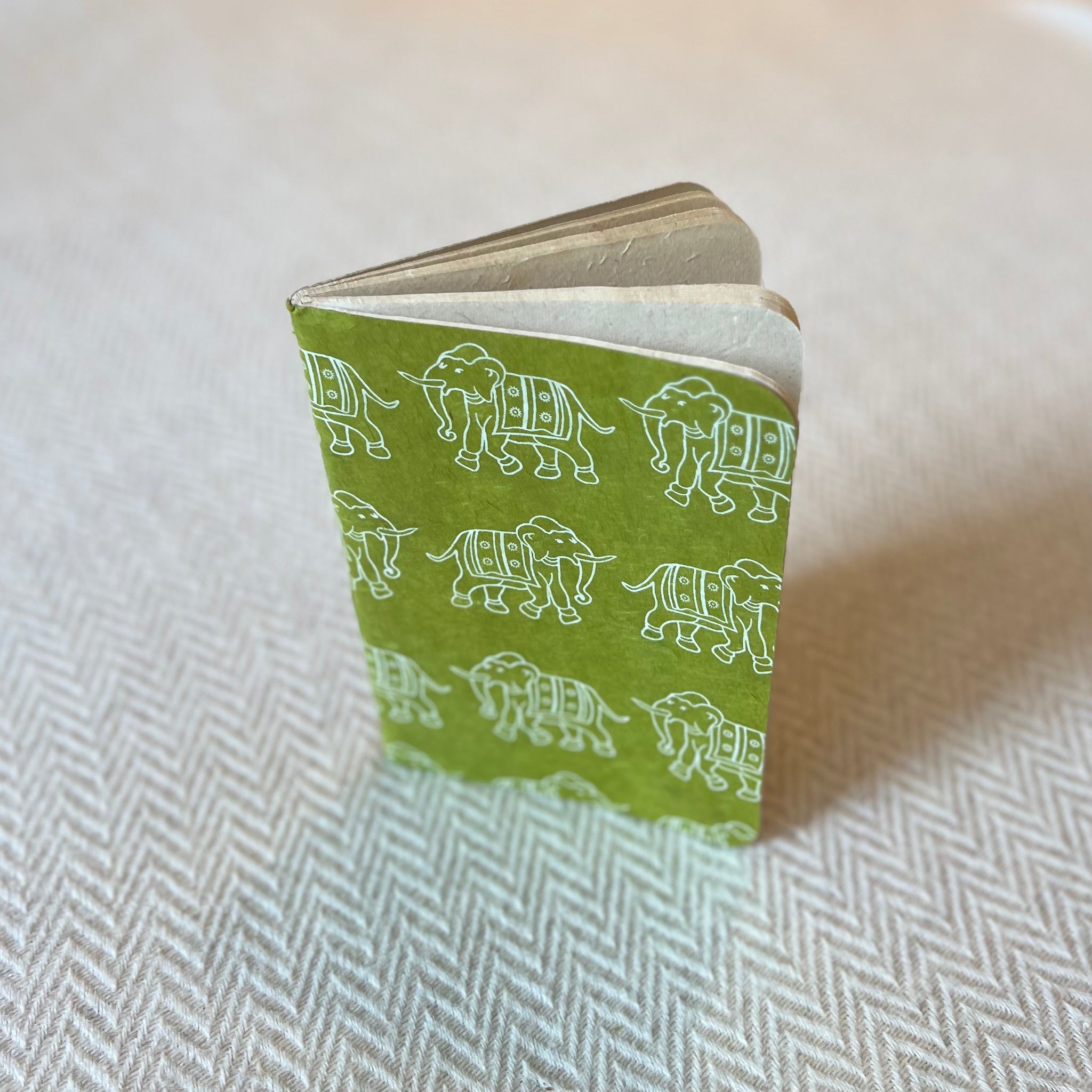 Lokta Paper Notebook in a green colour with a white elephant pattern
