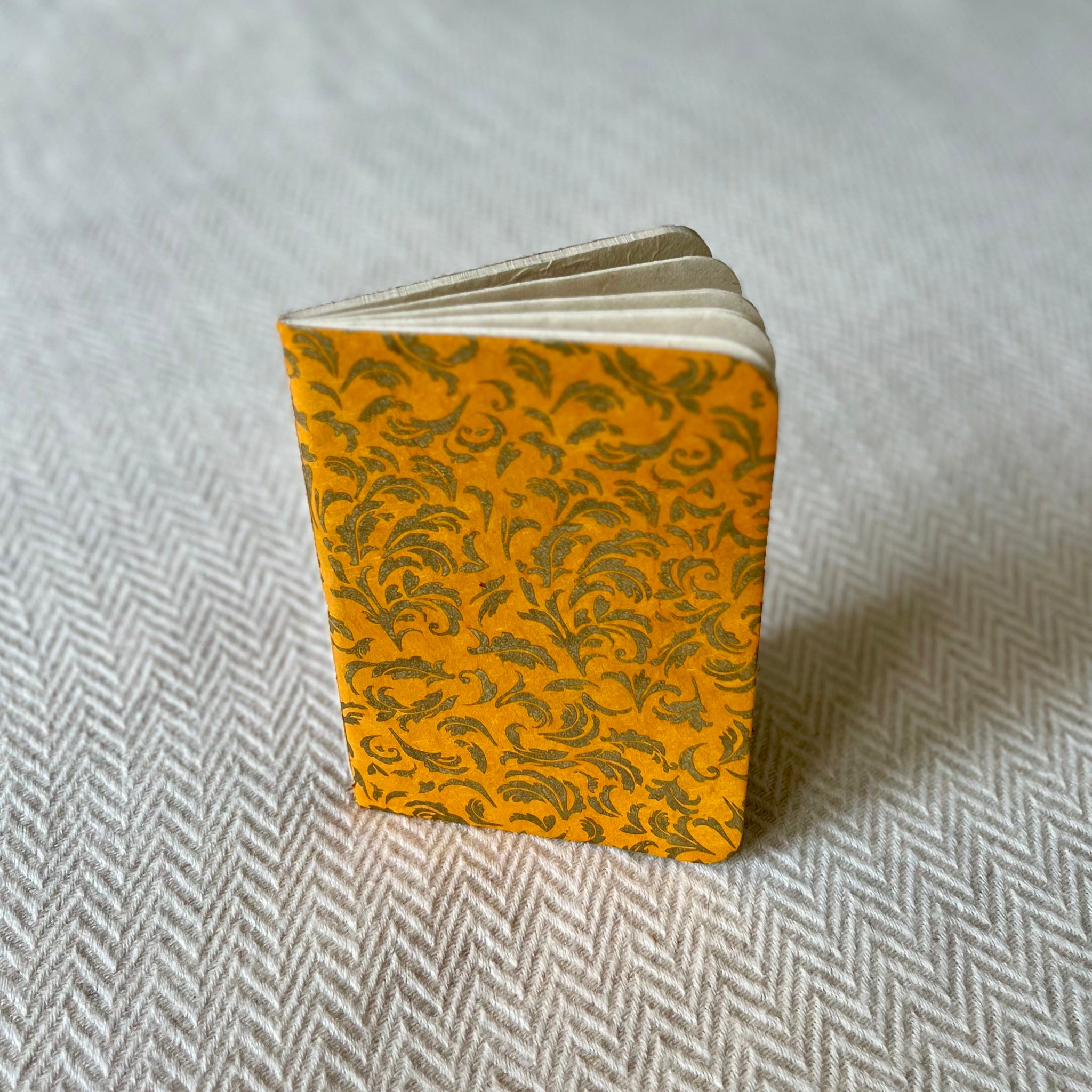 Lokta Paper Notebook in a yellow colour with a gold leaf pattern