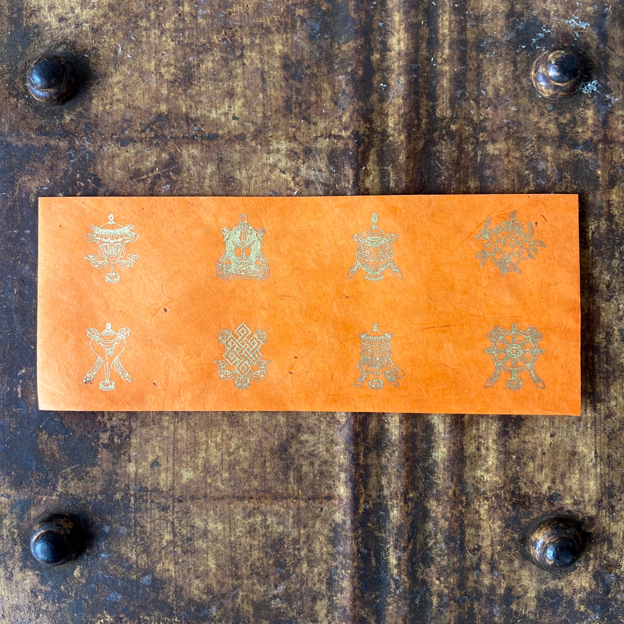 Orange Lokta Paper Offering Envelope with 8 auspicious symbols of Tibetan Buddhism in Gold