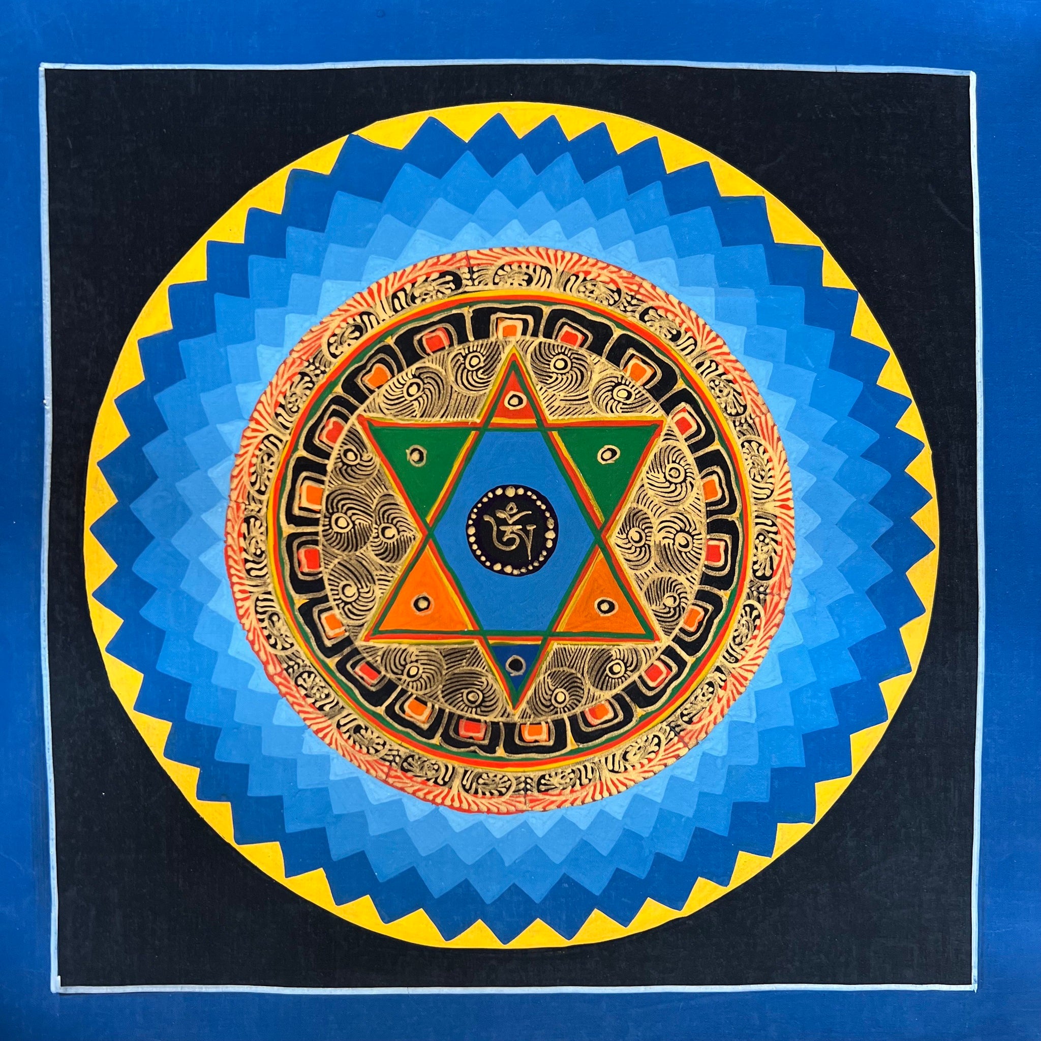 Mandala Painting with Blue and Back Background and Star in middle