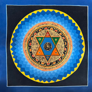 Mandala Painting with Om inside Star and a blue and black background