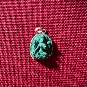 2.7cm sterling silver and resin pendant with a carving of Green Tara
