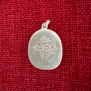 2.7cm sterling silver and resin pendant with a carving of Green Tara