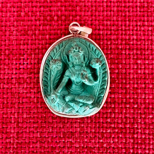 2.7cm sterling silver and resin pendant with a carving of Green Tara