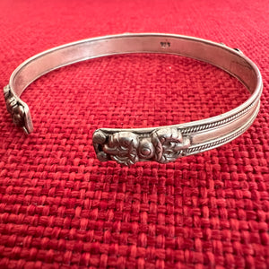 0.6cm wide flat shaped silver bangle with om mani padme hung mantra and dorje symbols