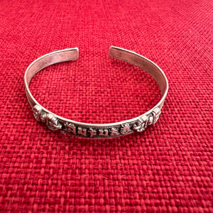 0.6cm wide flat shaped silver bangle with om mani padme hung mantra and dorje symbols