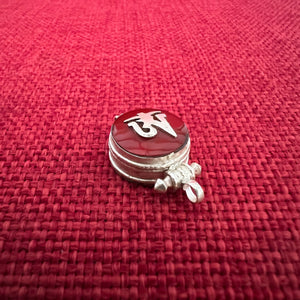 1.5cm diameter Sterling Silver Locket with the Tibetan Om symbol set on red colour semi-precious stone