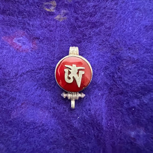 1.5cm diameter Sterling Silver Locket with the Tibetan Om symbol set on red colour semi-precious stone
