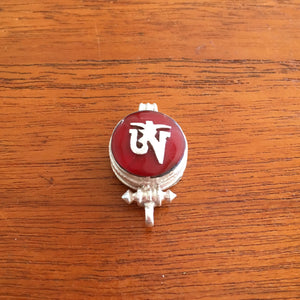 1.5cm diameter Sterling Silver Locket with the Tibetan Om symbol set on red colour semi-precious stone