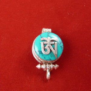 1.5cm diameter Sterling Silver Locket with the Tibetan Om symbol set on composite turquoise