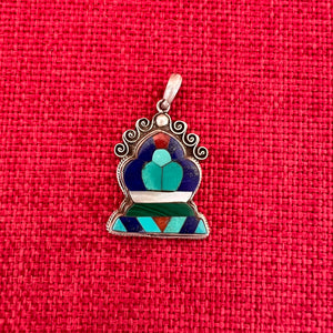 Silver and semi precious stone pendant in the shape of a Norbu
