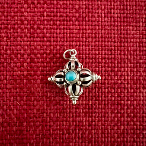 2cm silver '9 point' double dorje pendant with turquoise and coral detail
