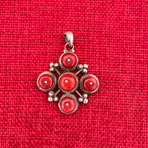 4cm sterling silver pendant with large coral stones in the symbolic shape of a Double Dorje