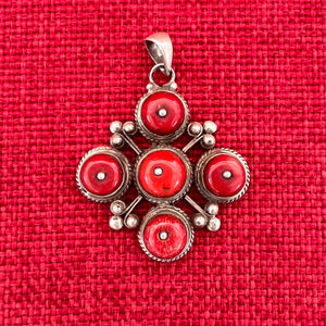 4cm sterling silver pendant with large coral stones in the symbolic shape of a Double Dorje