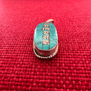 3.5cm long silver and turquoise pendant with silver inlay of the Om Mani Padme Hung mantra in Tibetan script