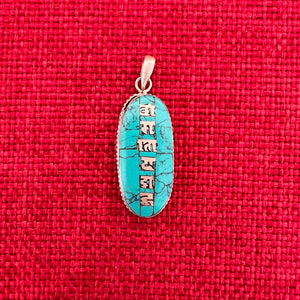 3.5cm long silver and turquoise pendant with silver inlay of the Om Mani Padme Hung mantra in Tibetan script