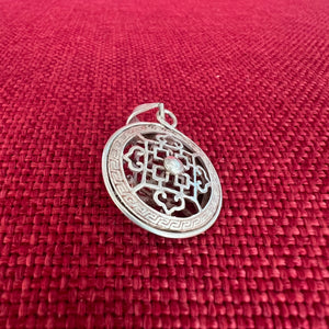 2cm silver pendant with Buddhist Mandala symbol on both sides and space between