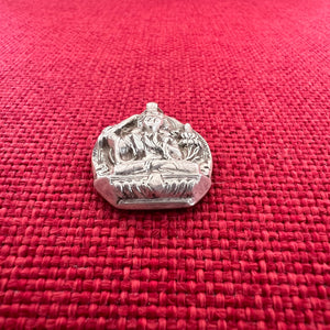 2.5cm high flat silver pendant with carved image of Manjushri