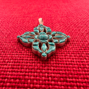 3.5cm sterling silver and turquoise pendant in the shape of a Double Dorje symbol