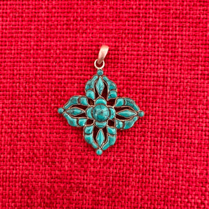 3.5cm sterling silver and turquoise pendant in the shape of a Double Dorje symbol
