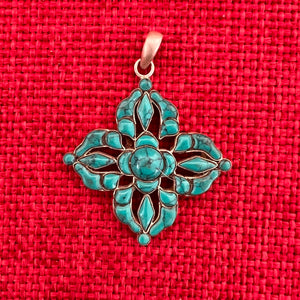 3.5cm sterling silver and turquoise pendant in the shape of a Double Dorje symbol